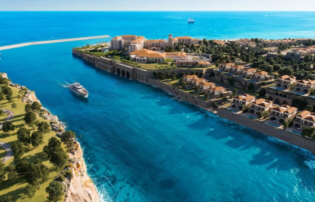 Blue waters and yacht surrounding Montage Ras El Hekma